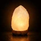 Pale Crystal Salt Lamp, 3-5kg – studio photo lit against a dark background