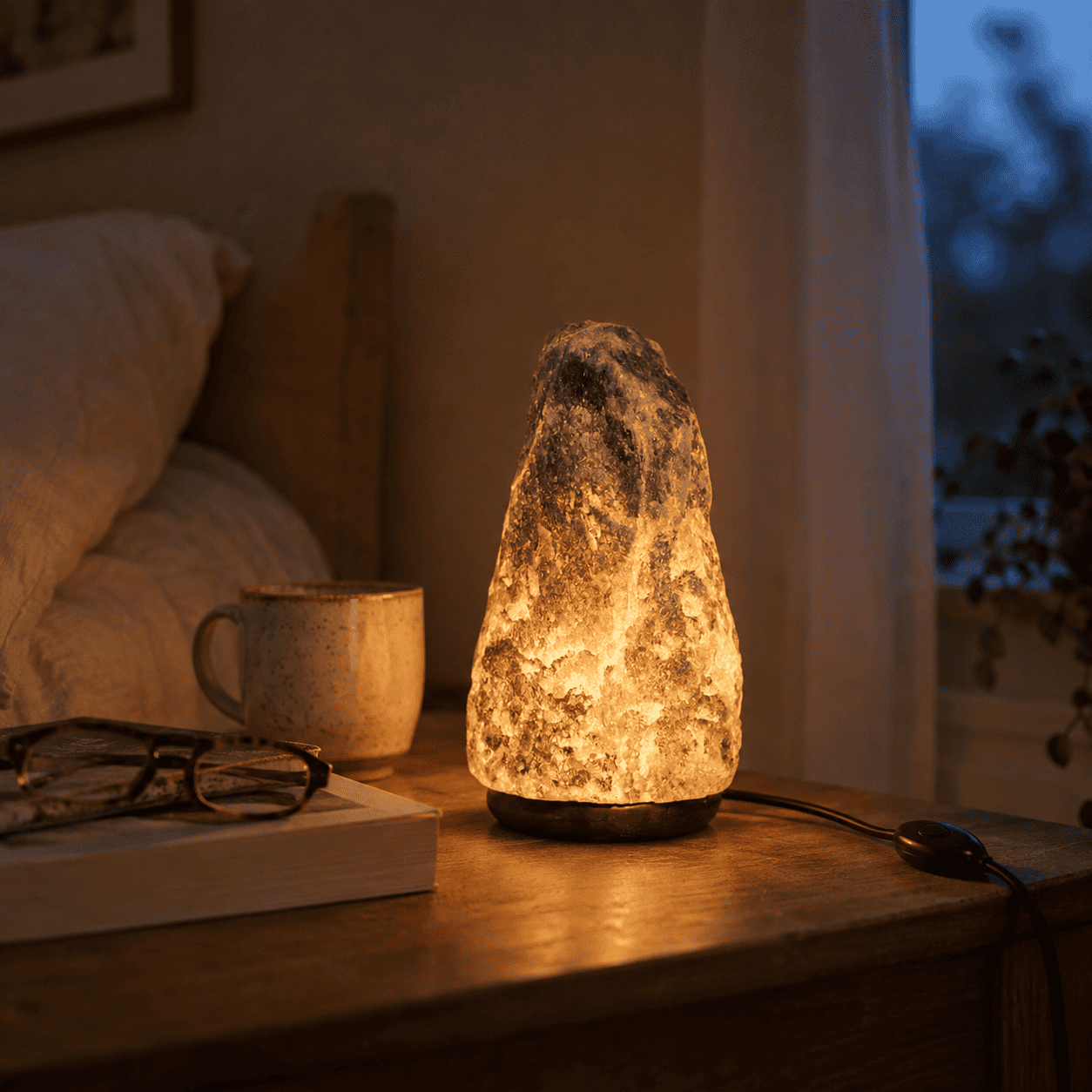 Grey-Toned Salt Lamp, 3-5kg – styled in a home lifestyle setting, lit at evening