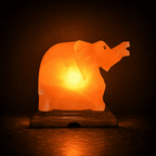 Elephant-Carved Salt Lamp – studio photo lit against a dark background