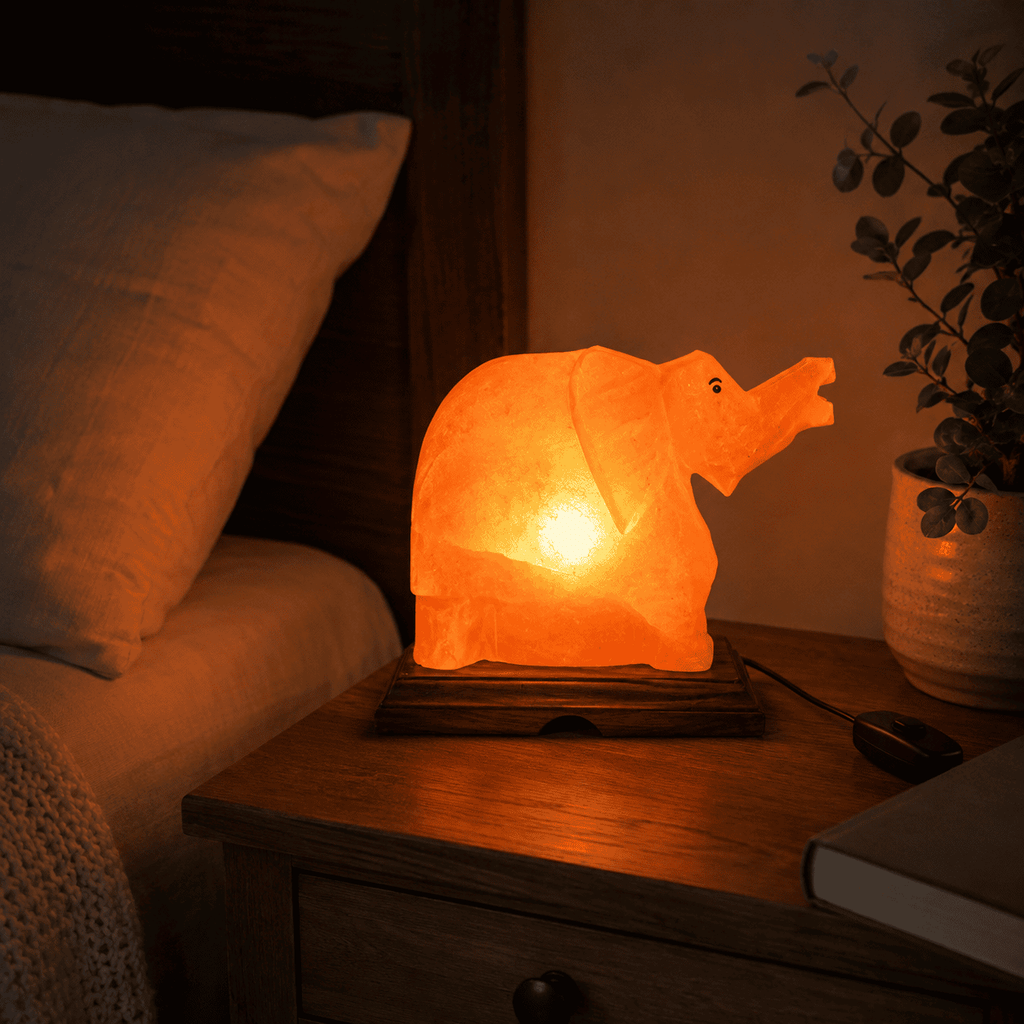 Elephant-Carved Salt Lamp – styled in a home lifestyle setting, lit at evening