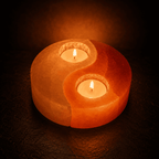 Yin Yang Salt Tealight Holder – studio photo lit against a dark background