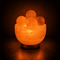 Salt Fire Bowl with Massage Balls – studio photo lit against a dark background