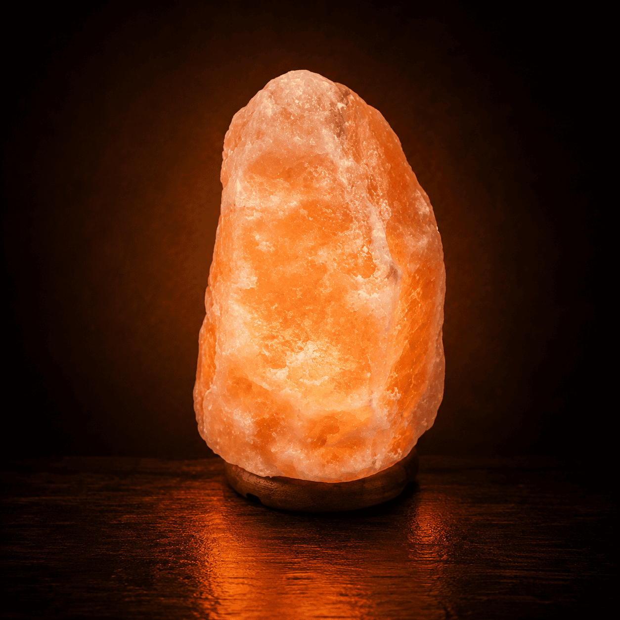 Himalayan Rock Salt Lamp, 12-15kg – studio photo lit against a dark background