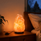 Himalayan Rock Salt Lamp, 2-3kg – styled in a home lifestyle setting, lit at evening