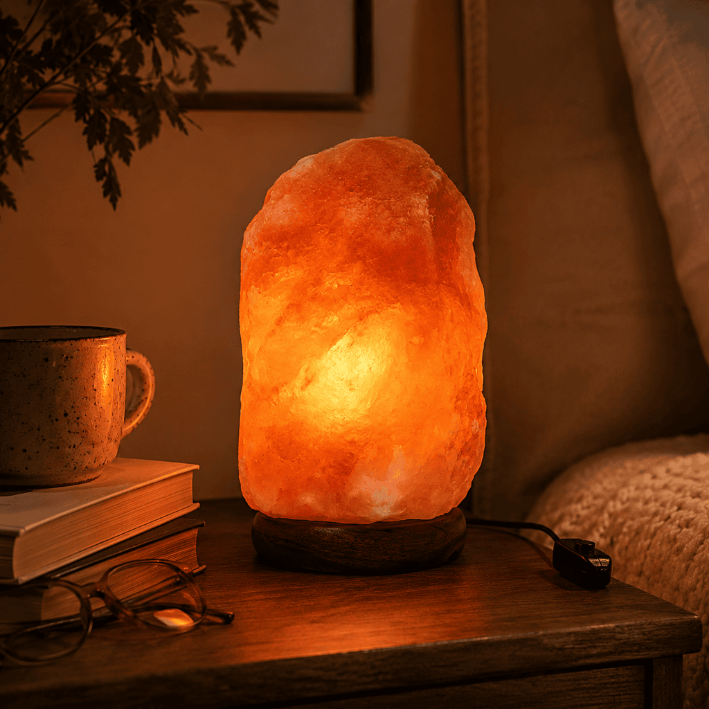 Himalayan Rock Salt Lamp, 3-5kg – styled in a home lifestyle setting, lit at evening