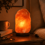 Himalayan Rock Salt Lamp, 3-5kg – styled in a home lifestyle setting, lit at evening