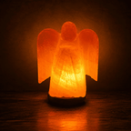 Angel-Carved Salt Lamp – studio photo lit against a dark background