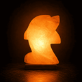Dolphin-Carved Salt Lamp – studio photo lit against a dark background