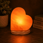 Heart-Carved Salt Lamp – studio photo lit against a dark background