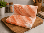 Himalayan Salt Tiles, Pack of 2 – styled in a home lifestyle setting, lit at evening